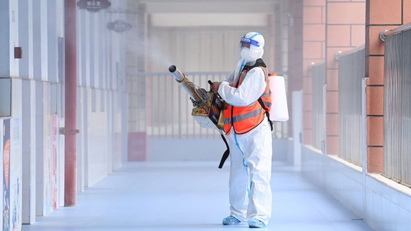 Worker disinfects primary school in Wuhan