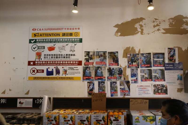 一面墙贴满了商店扒手的照片。